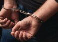 police conducted a operation and arrested a man in handcuffs